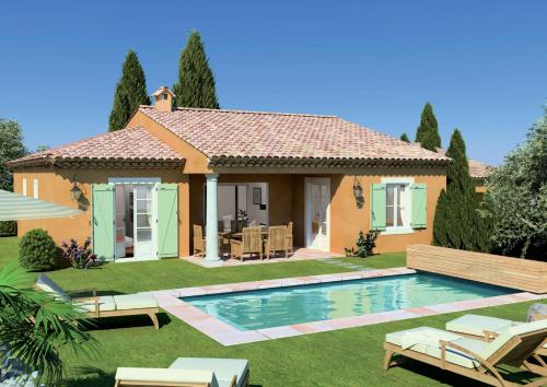 a house with a swimming pool in the yard at Lagrange Vacances - Le Domaine de l'Eilen in Cavalaire-sur-Mer