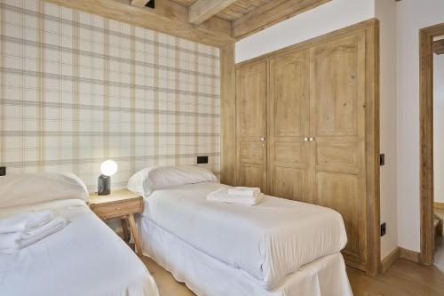 Voodi või voodid majutusasutuse Luderna - Casa con terraza Codorna toas