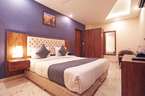 a bedroom with a large bed in a room at Mayda Inn- A Boutique Hotel in New Delhi