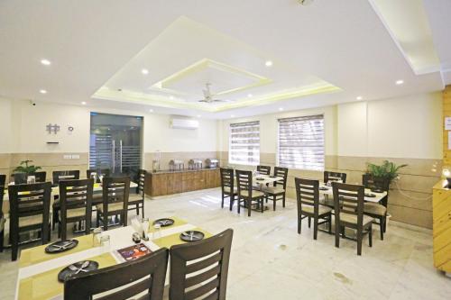 a dining room with tables and chairs in a restaurant at Mayda Inn- A Boutique Hotel in New Delhi