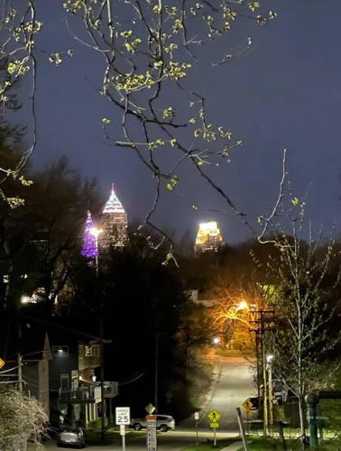 a city street at night with lit up buildings at Trendy in Tremont, CLE (Lower) in Cleveland
