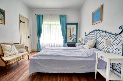 Un ou plusieurs lits dans un hébergement de l'établissement Maison BOGArT