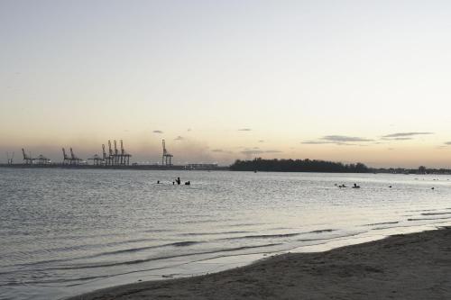 a group of people in the water at the beach at Villa Gumio Studio Apt - 7 minutes walk to Boca Chica Beach apts in Boca Chica