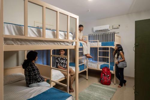 a group of people in a room with bunk beds at Zostel Kochi, Fort Kochi in Cochin