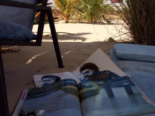 an open book with a picture of a woman on it at Cytyz Appart Hôtel in Mahajanga