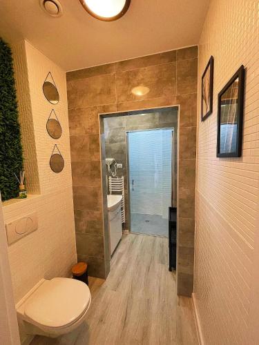 a bathroom with a toilet and a sink at Great Polonia River Boat Apartments Wrocław in Wrocław