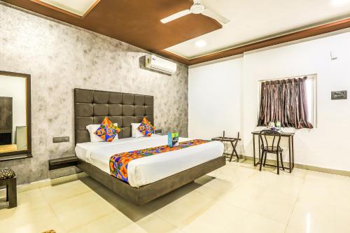 a bedroom with a large bed in a room at FabHotel Prime Sea Shore Resort in Calangute