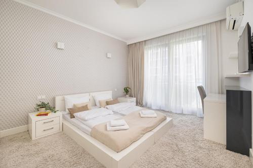 Posteľ alebo postele v izbe v ubytovaní ECRU 3-Bedroom Luxurious Apartment WWA21