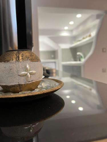 a bowl sitting on a counter in a kitchen at Aegean Breeze Minimal Central in Naxos Chora