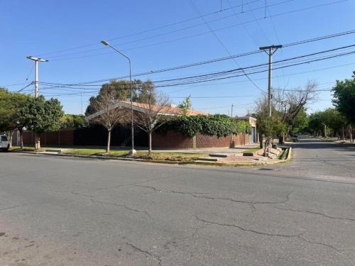 an empty street in front of a brick building at Morada Luminosa - San Juan, Capital in San Juan