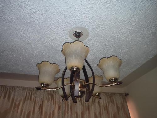 a chandelier is hanging from a ceiling at Classy Spacious Studio - Waiyaki Way in Rungiri