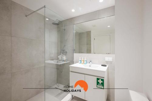 a bathroom with a shower and a sink and a mirror at #081 T1 Vale Mangude 312 by Home Holidays in Vale de Pedras