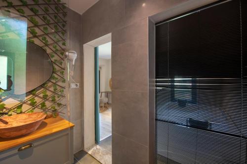 a bathroom with a shower with a glass door at Eroğlu Villas in Fethiye