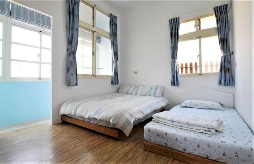 Postel nebo postele na pokoji v ubytování Caramel Macchiato Homestay