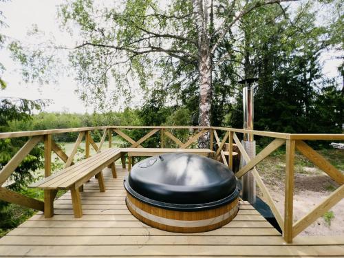 a black bean bag chair sitting on a wooden deck at Kullanpuu's Farm Stay in Kirjakkala