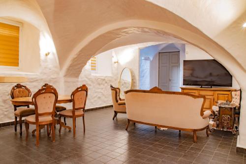 a dining room with a table and chairs at Center apartment with Sauna - Free parking in Tartu