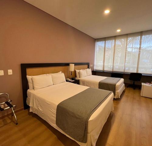 Postel nebo postele na pokoji v ubytování Mi Hotel Sandiego
