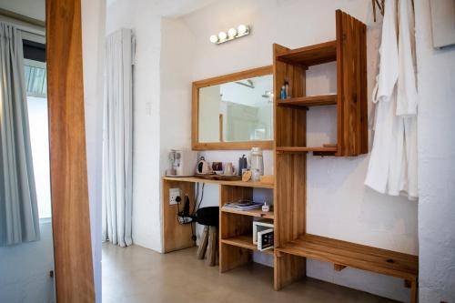 a bathroom with a mirror on the wall at Qambathi Mountain Lodge in Kamberg Valley
