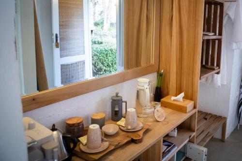 a kitchen with a counter top with a mirror at Qambathi Mountain Lodge in Kamberg Valley