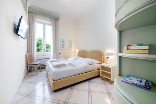 a bedroom with a bed and a window at B&B Marcantonio - Ischia Ponte in Ischia