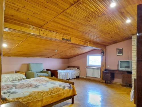 a bedroom with a bed and a tv in a room at Star Apartment in Ashtarak, Mughni in Ashtarak