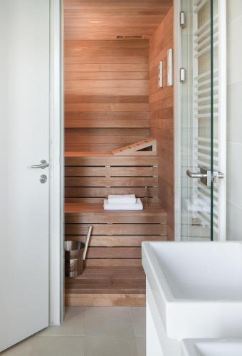 a bathroom with a toilet and a sink at Park Hill Residences in Rabac