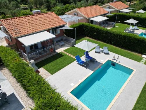 an aerial view of a villa with a swimming pool at Cypress Garden Villas in Svoronata