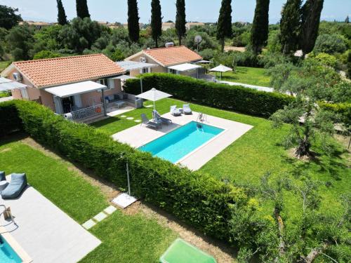 an aerial view of a villa with a swimming pool at Cypress Garden Villas in Svoronata