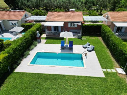 an overhead view of a backyard with a swimming pool at Cypress Garden Villas in Svoronata