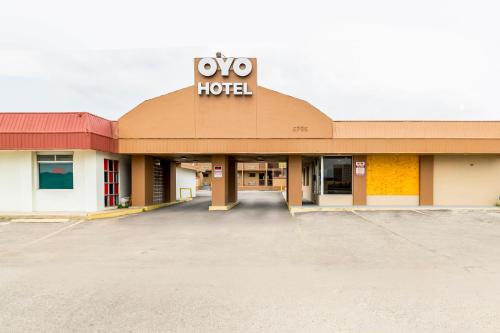 a building with a hotel sign on top of it at Oyo Hotel San Antonio Lackland AFB Seaworld Hwy 90 W in San Antonio