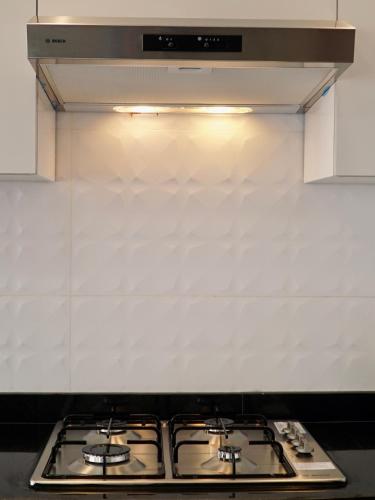 Kuchyň nebo kuchyňský kout v ubytování Appartement moderne au décor raffiné