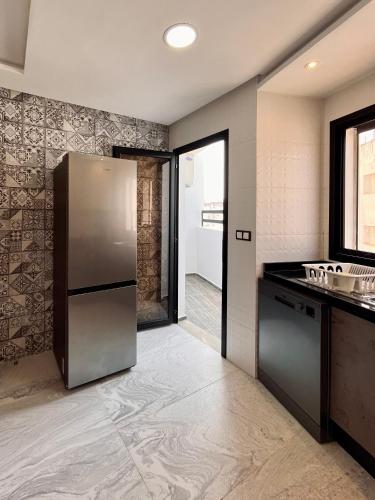 Kuchyň nebo kuchyňský kout v ubytování Appartement moderne au décor raffiné