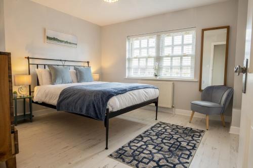 En eller flere senge i et værelse på Saxon House