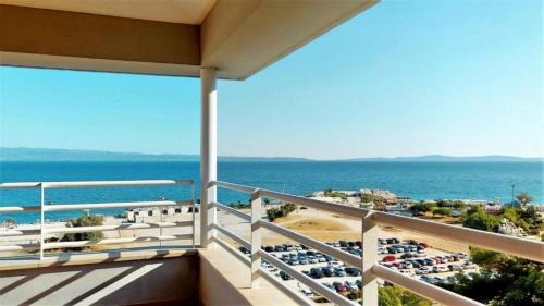 a balcony with a view of the ocean at Apartments M in Split
