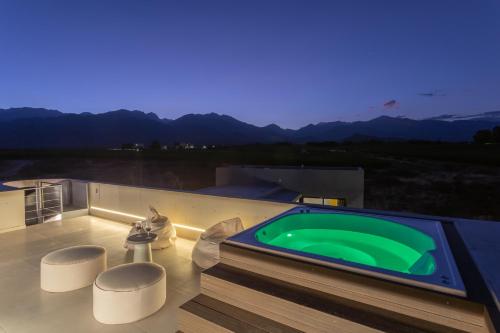 a green swimming pool on the roof of a house at Casa de Uco Vineyards and Wine Resort in Los Árboles