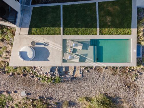 an overhead view of a swimming pool and a house at Casa de Uco Vineyards and Wine Resort in Los Árboles