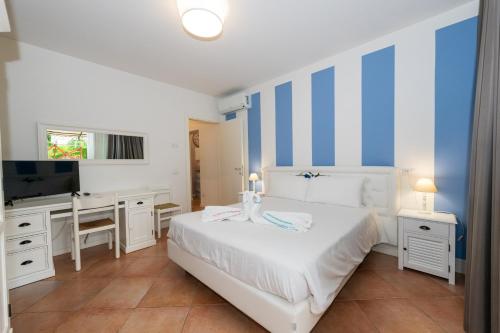 Ένα ή περισσότερα κρεβάτια σε δωμάτιο στο Bertoletta Village Apartments