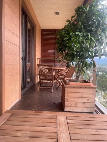 a porch with a table and a potted plant at Oasis Chakvi apartment 1406 in Chakvi