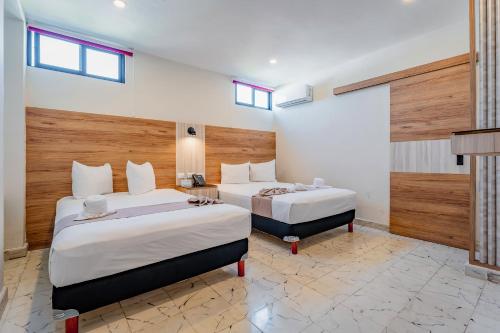 Postel nebo postele na pokoji v ubytování Hotel Central Merida by Kavia