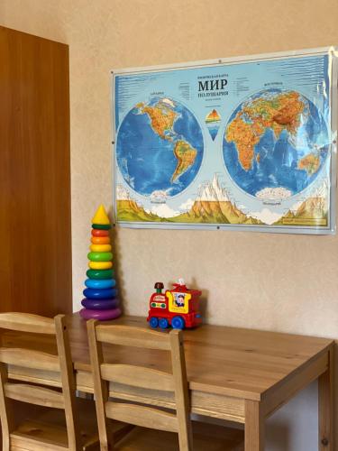 a table with a toy truck sitting on top of it at Opushka in Vorobʼyëvka