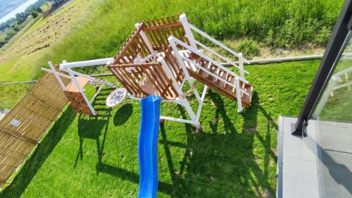 an aerial view of a swing set on a house at To Je To apartamenty in Maniowy
