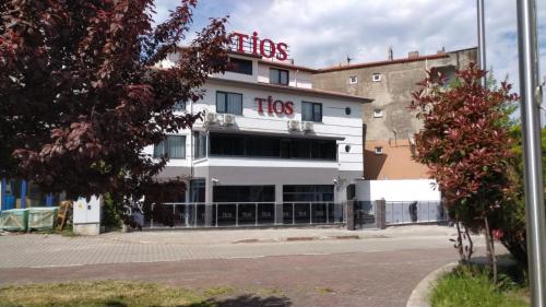 a large white building with a hos sign on it at TİOS OTEL in Zonguldak