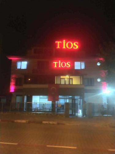 a tico sign in front of a building at night at TİOS OTEL in Zonguldak