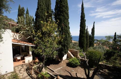 a villa with a view of the ocean at * * * Cypress Villa * * * {Free Parking} in Giglio Porto