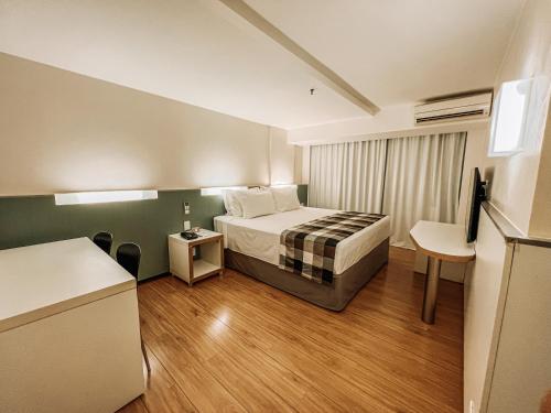 Ένα ή περισσότερα κρεβάτια σε δωμάτιο στο St Paul Plaza Hotel