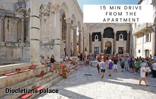 a large group of people walking around a building at Modern oasis apartment Split PRIVATE PARKING in Split