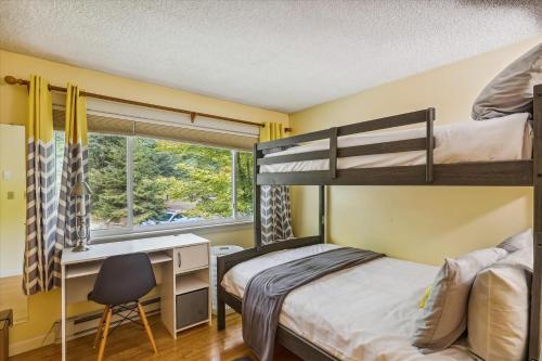 a bedroom with two bunk beds and a desk at Foxhill 7 in Stowe