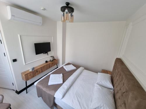 Ένα ή περισσότερα κρεβάτια σε δωμάτιο στο Elite Park Hotel & Suites