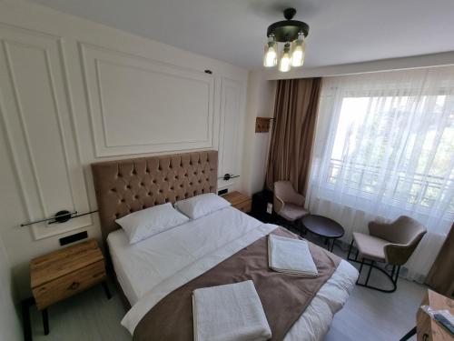 Ένα ή περισσότερα κρεβάτια σε δωμάτιο στο Elite Park Hotel & Suites