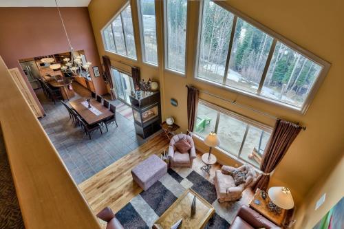 an overhead view of a living room and dining room at Soleil Chalet By Bear Country in Sun Peaks